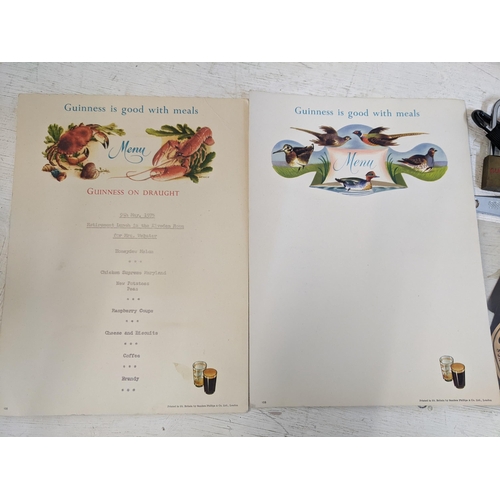 319A - Guinness advertising collectables to include miniature beer bottles, a retirement menu, bottle opene... 