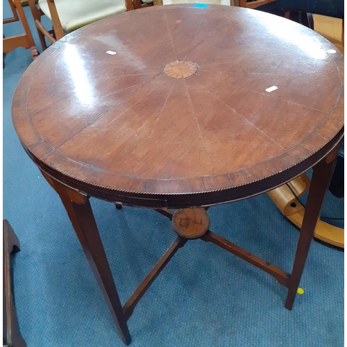 432 - An early 20th century circular cross banded table
Location: RAF