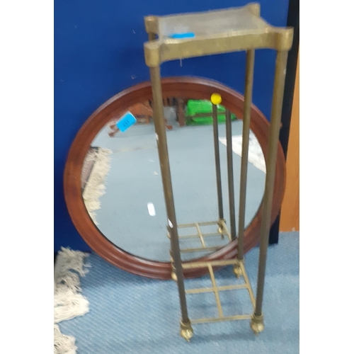 437 - An early 20th century circular mahogany wall mirror and a brass floor standing umbrella/stick stand
... 