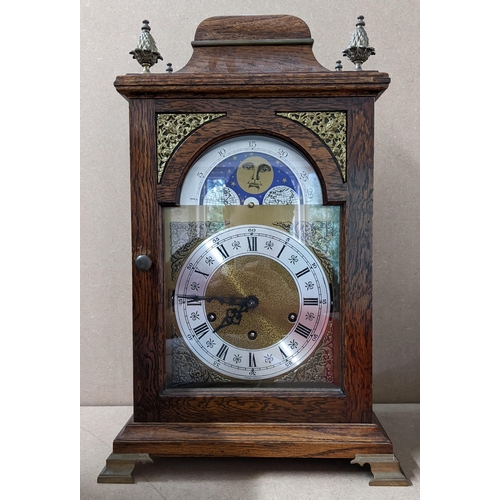 448 - A mid 20th century 8-day oak cased bracket clock having moon phase, strike selection lever for Westm... 