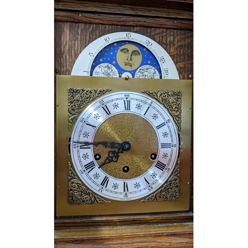 448 - A mid 20th century 8-day oak cased bracket clock having moon phase, strike selection lever for Westm... 