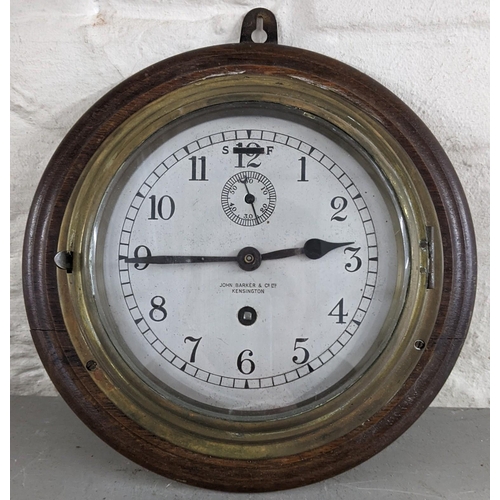 452 - An early/mid 20th century brass ship's clock by John Barker & Co Ltd Location:LAF