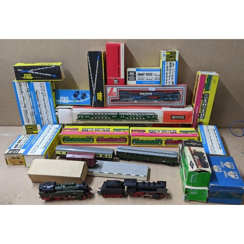 488 - A selection of boxed and loose HO gauge to include two Eisenbahn-Modelbau locomotives, Schicht carri... 