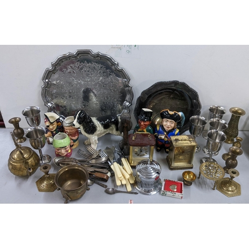 493 - A mixed lot to include Toby jugs, Coopercraft model of a dog, metalware, carriage clocks and other i... 