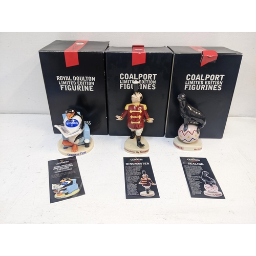 300 - Guinness related collectables, a Royal Doulton and two Coalport limited edition figures 'Penguin', '... 