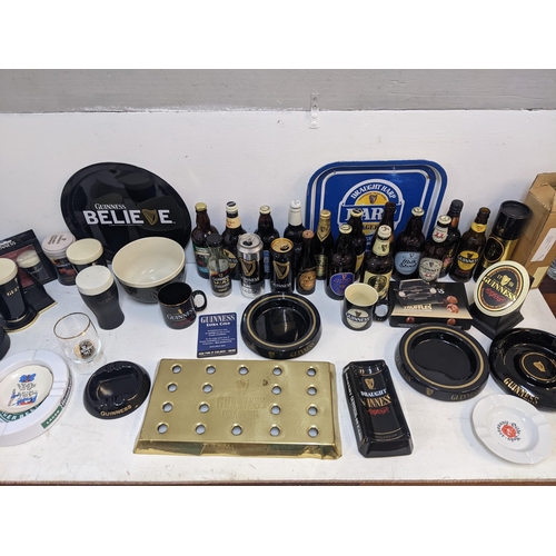 301 - Guinness - Bar related items to include beer cans, bottles, illuminated handpump signs, ashtrays, mu... 