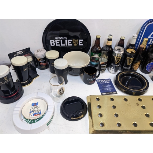 301 - Guinness - Bar related items to include beer cans, bottles, illuminated handpump signs, ashtrays, mu... 