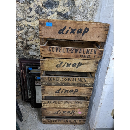 457 - A mixed lot to include four DIXAP vintage wooden crates, two framed wall mirrors, two green glass bo... 