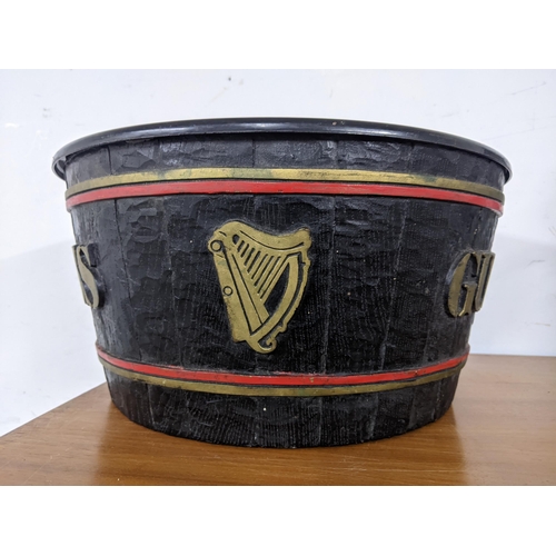 308 - Guinness - a composition advertising ice bucket fashioned as a barrel 36cm dia. Location: G