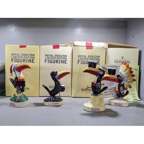 310 - Four Royal Doulton Guinness advertising toucans, Christmas Seaside, Big Chief and Miner, boxed Locat... 