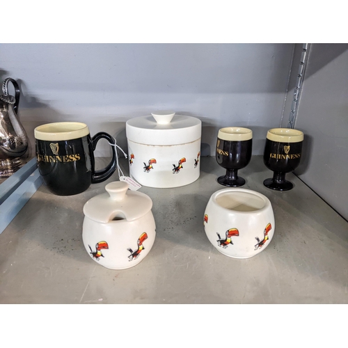 311 - Carlton ware Guinness advertising ceramics comprising two eggcups, condiments, a mug and a lidded po... 