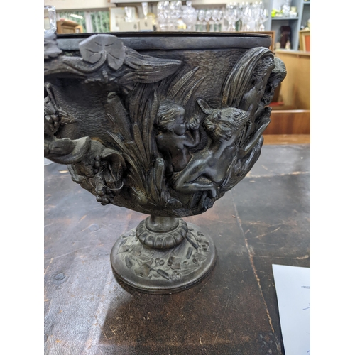 445 - A 19th century bronze twin handled bowl in the Classical style decorated with Grecian figures, 23cm ... 