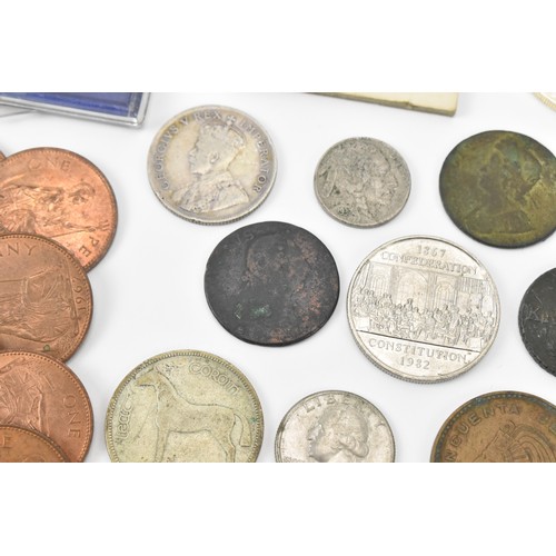 62 - Coins of Interest - A mixed collection to include a 1997 1oz fine silver USA Dollar, 1927 Parliament... 