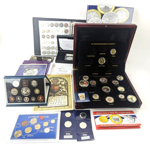 86 - A mixed group of UK and other world proof and other coinage to include a change checker album of £2 ... 