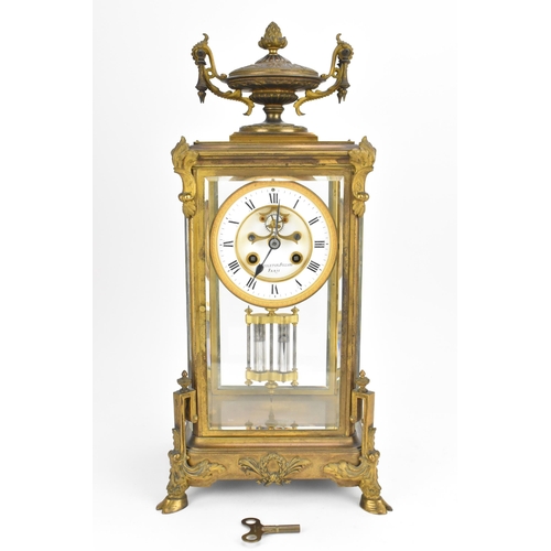 117 - A French 19th century ormolu mounted four glass mantle clock, with central enamel dial with Roman nu... 