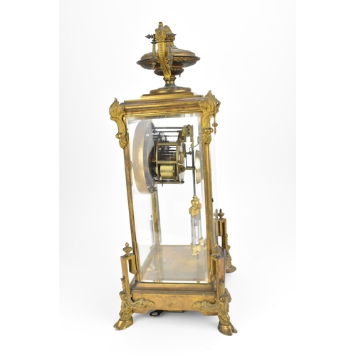 117 - A French 19th century ormolu mounted four glass mantle clock, with central enamel dial with Roman nu... 