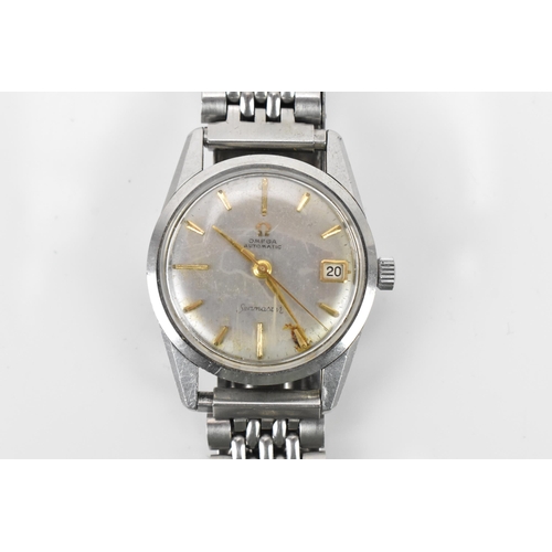 106 - An Omega Seamaster, automatic, gents, stainless steel wristwatch, having a silvered dial, centre sec... 