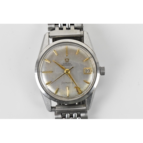 106 - An Omega Seamaster, automatic, gents, stainless steel wristwatch, having a silvered dial, centre sec... 