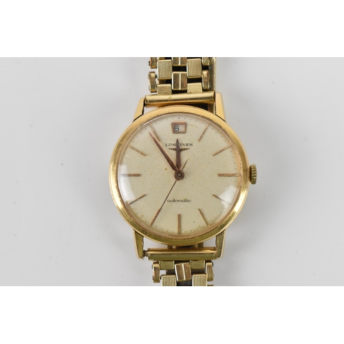 107 - A Longines, automatic, gents, 18ct gold wristwatch, having a silvered dial, centre seconds, gilt bat... 