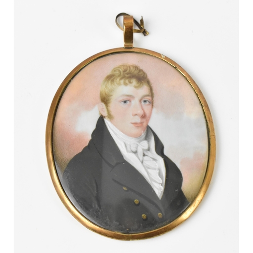 162 - A 19th century portrait miniature on ivory of a gentleman, wearing a white frill cravate and black j... 