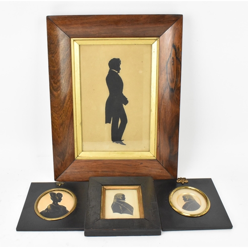 163 - A collection of 19th century silhouettes, comprising a lady, two gentlemen, with gilt highlights in ... 