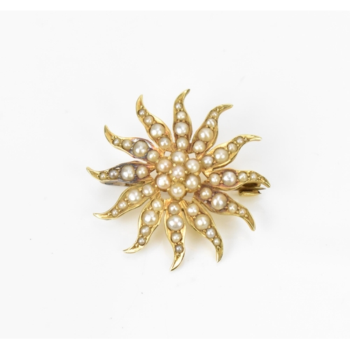 183 - An Edwardian 15ct yellow gold and split seed pearl starburst brooch, 3 cm diameter, 4.9 grams