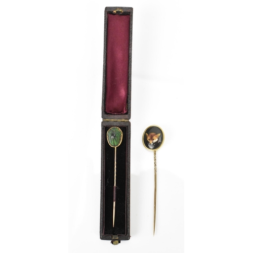 185 - A William Essex style fox head stick pin, together with a Victorian scarab inset stick pin in fitted... 