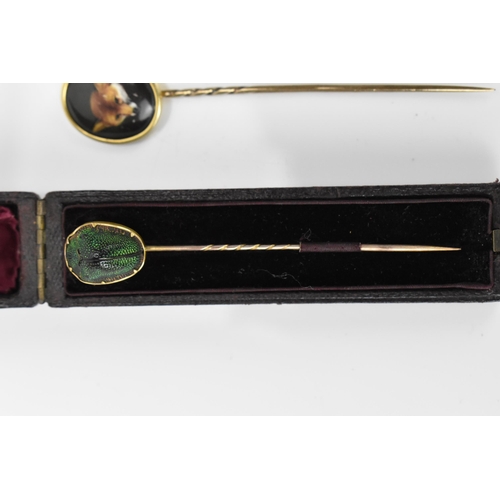 185 - A William Essex style fox head stick pin, together with a Victorian scarab inset stick pin in fitted... 