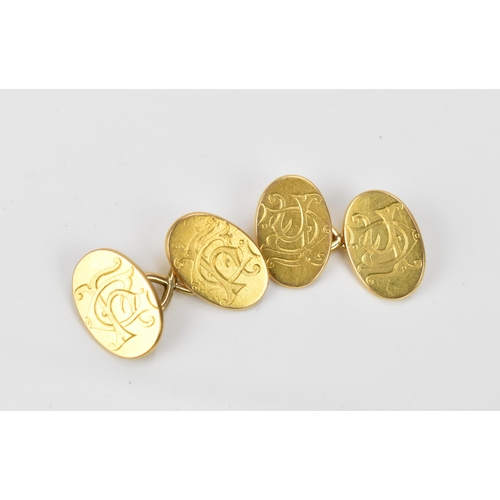 186 - A pair of Victorian 15ct yellow gold cufflinks, of oval form with engraved monogram, fully hallmarke... 