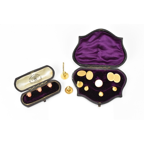 187 - A pair of early 20th century 9ct yellow gold cuff links, together with a boxed set of 18ct dress stu... 