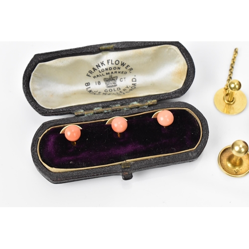 187 - A pair of early 20th century 9ct yellow gold cuff links, together with a boxed set of 18ct dress stu... 