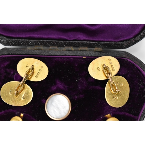 187 - A pair of early 20th century 9ct yellow gold cuff links, together with a boxed set of 18ct dress stu... 