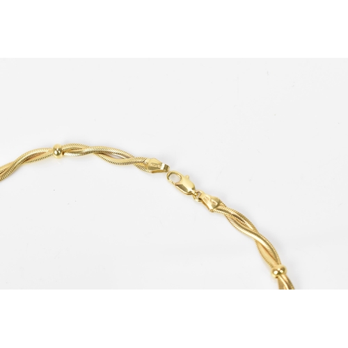 188 - An Italian 9ct yellow gold necklace with intertwined snake chain and spaced gold rings, 42 cm long, ... 