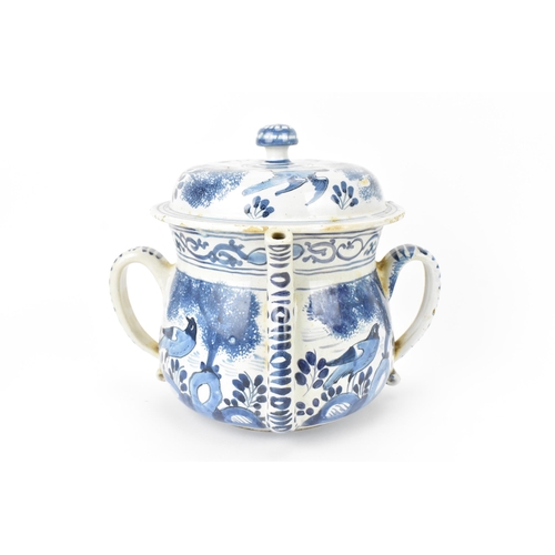 199 - An 18th century British blue and white delft posset pot and cover, London or Bristol, together with ... 