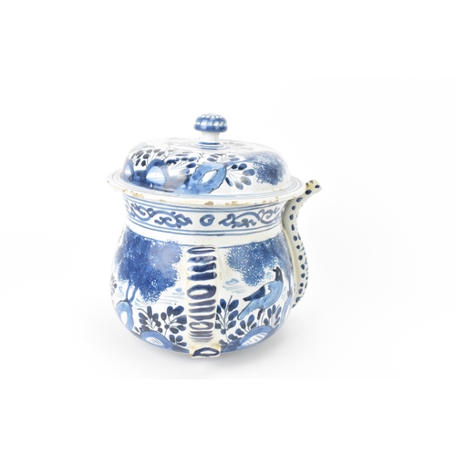 199 - An 18th century British blue and white delft posset pot and cover, London or Bristol, together with ... 