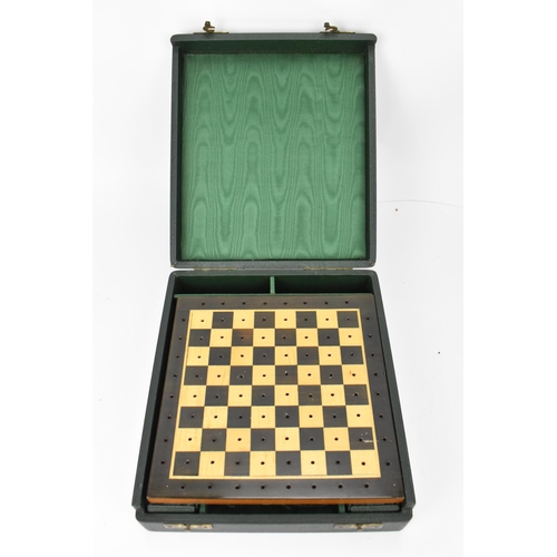 203 - A 20th century games compendium, with wooden checkered board, resin chess pieces, dominos, and check... 