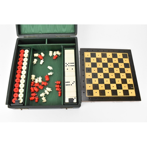 203 - A 20th century games compendium, with wooden checkered board, resin chess pieces, dominos, and check... 