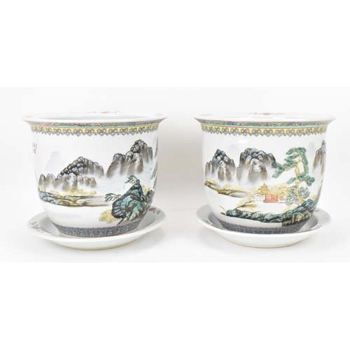 211 - A pair of Chinese 20th century porcelain planters, each depicting enamel mountainous landscapes with... 