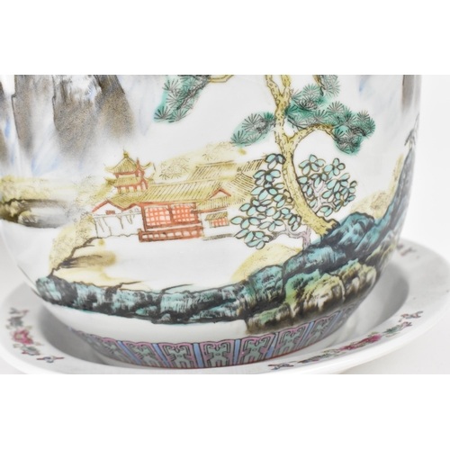 211 - A pair of Chinese 20th century porcelain planters, each depicting enamel mountainous landscapes with... 