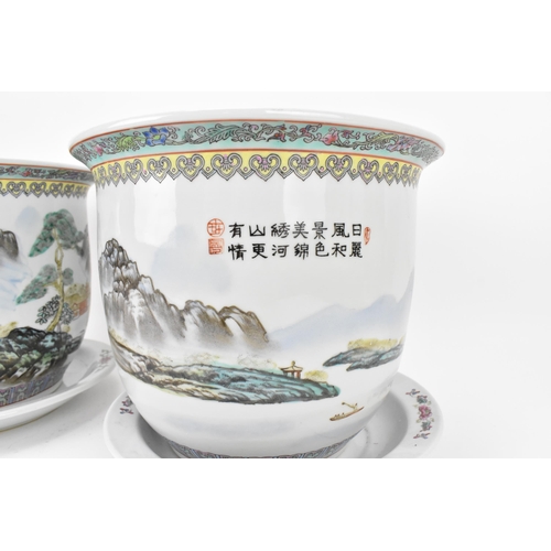 211 - A pair of Chinese 20th century porcelain planters, each depicting enamel mountainous landscapes with... 