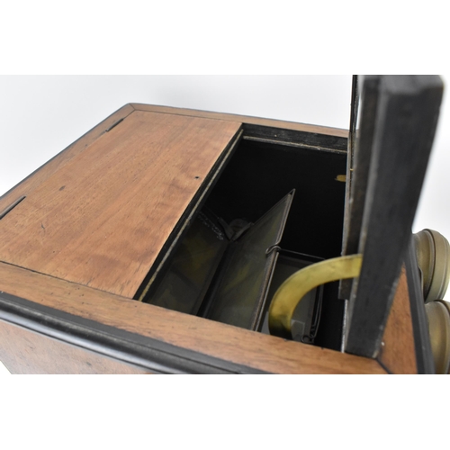 212 - A Victorian walnut and ebonised wood table-top stereoscope viewer, with cranking mechanism, with adj... 