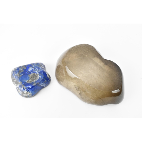 213 - A rutilated quartz freeform bowl, together with a smaller freeform polished lapis lazuli bowl, the q... 