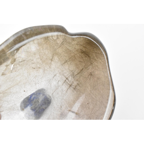 213 - A rutilated quartz freeform bowl, together with a smaller freeform polished lapis lazuli bowl, the q... 