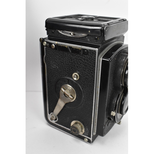 215 - THIS LOT HAS BEEN WITHDRAWN

A 1930s Rolleiflex Compur box Camera, serial no 427867, Compur shutter,... 