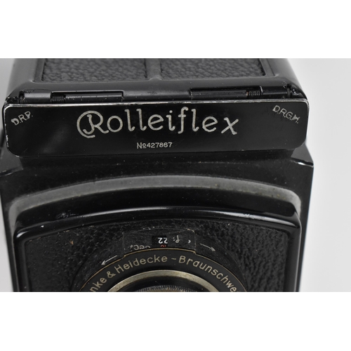 215 - THIS LOT HAS BEEN WITHDRAWN

A 1930s Rolleiflex Compur box Camera, serial no 427867, Compur shutter,... 