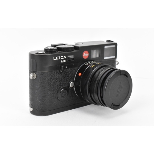 234 - A Leica M6 TTL camera, black, serial no 2734253, 1998–2002, with Leica Summicron-M 1:2/50 E39 376689... 