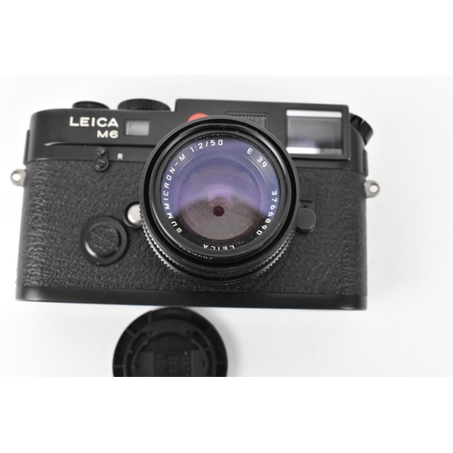 234 - A Leica M6 TTL camera, black, serial no 2734253, 1998–2002, with Leica Summicron-M 1:2/50 E39 376689... 