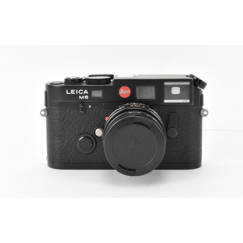 234 - A Leica M6 TTL camera, black, serial no 2734253, 1998–2002, with Leica Summicron-M 1:2/50 E39 376689... 