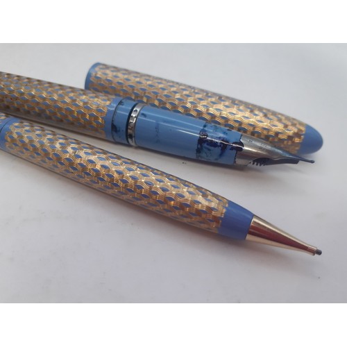7 - Lady Sheaffer Skripsert fountain pen and ballpoint pen in a gold and pale blue design housed in a Sh... 