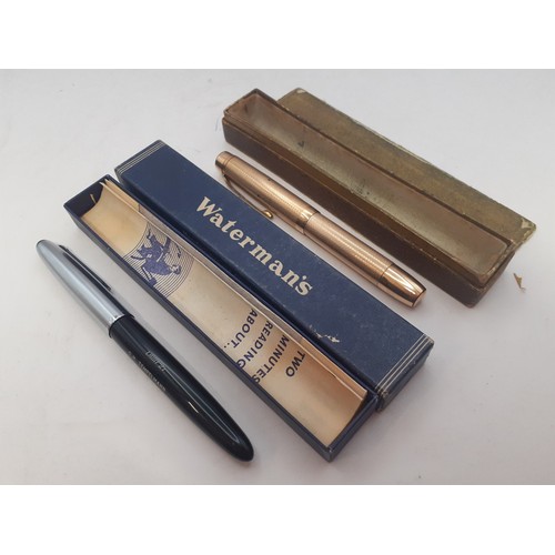 11 - Two vintage pens comprising a gold tone fountain pen having a 14ct De La Rue Onoto nib and a Waterma... 